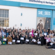 School and college staff gathered outside Boathouse 4 with their certificates after attending special event