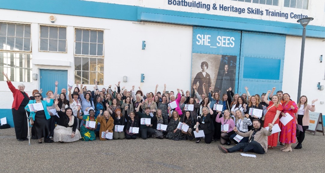 School and college staff gathered outside Boathouse 4 with their certificates after attending special event