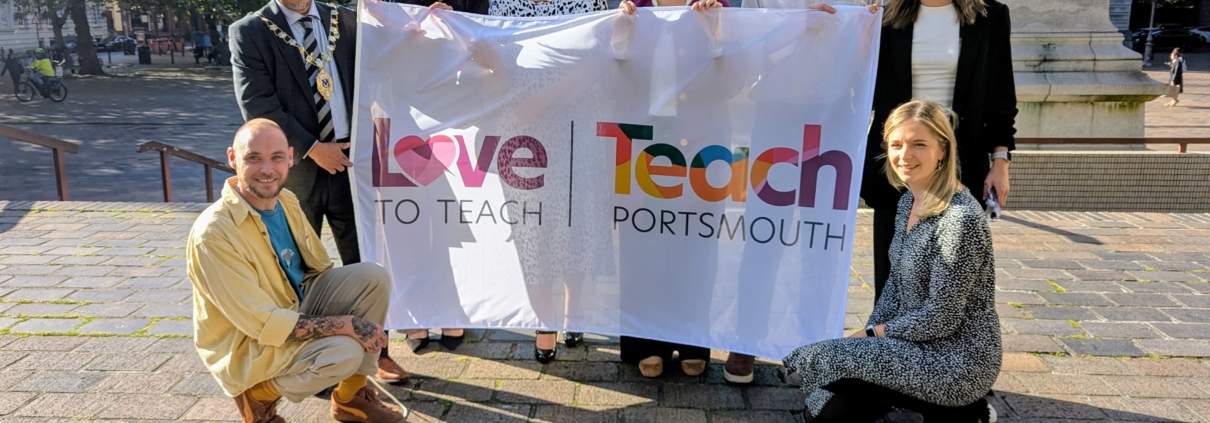 Raising the Love to Teach flag outside Portsmouth Civic Offices